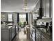 Updated kitchen with granite countertops, stainless steel appliances, and gray cabinets at 265 Celestial Blvd, Summerville, SC 29486