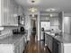 Bright kitchen with gray cabinets, stainless steel appliances, granite counters and pendant lighting at 265 Celestial Blvd, Summerville, SC 29486