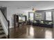 Spacious living room with hardwood floors, comfortable leather seating, and a cozy fireplace at 265 Celestial Blvd, Summerville, SC 29486