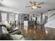 Open-concept living room and kitchen featuring hardwood floors, gray cabinets, and stainless steel appliances at 265 Celestial Blvd, Summerville, SC 29486