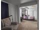 Charming main bedroom with upholstered furniture, soft light, and view into an adjoining living area at 265 Celestial Blvd, Summerville, SC 29486