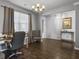 Well-lit office featuring hardwood floors, a large window, and gray walls at 265 Celestial Blvd, Summerville, SC 29486