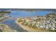 Aerial shot of coastal homes near a body of water with a bridge in the background, highlighting the waterfront location at 2745 Oak Manor Dr, Mount Pleasant, SC 29466