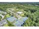 Aerial view of neighborhood tennis courts, community pool and surrounding landscape at 2745 Oak Manor Dr, Mount Pleasant, SC 29466