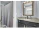 Updated bathroom features a dark vanity with granite countertop and a shower with curtain at 2745 Oak Manor Dr, Mount Pleasant, SC 29466