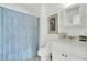 Clean bathroom with white vanity, toilet, and decorative blue shower curtain at 2745 Oak Manor Dr, Mount Pleasant, SC 29466