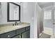 Bathroom showcasing a dark vanity with gold hardware and a shower at 2745 Oak Manor Dr, Mount Pleasant, SC 29466