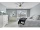 Bright bedroom with a ceiling fan, large window, and a dresser with a TV at 2745 Oak Manor Dr, Mount Pleasant, SC 29466