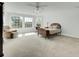 Large, sunny bedroom with a cozy reading area and hardwood floors at 2745 Oak Manor Dr, Mount Pleasant, SC 29466