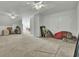 Large bonus room with carpet, white walls, ceiling fans and plentiful storage at 2745 Oak Manor Dr, Mount Pleasant, SC 29466