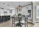Dining area with hardwood floors, a modern chandelier, and a view into the kitchen at 2745 Oak Manor Dr, Mount Pleasant, SC 29466