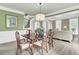 Dining room features a dining table, hardwood floors, and a view into the living room at 2745 Oak Manor Dr, Mount Pleasant, SC 29466