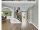 Bright foyer with hardwood floors, staircase, and views of the dining room and formal living room at 2745 Oak Manor Dr, Mount Pleasant, SC 29466