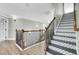 Hallway features decorative tile stairs, and updated lighting at 2745 Oak Manor Dr, Mount Pleasant, SC 29466