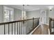 Hallway with wood floors, chandelier, and a stairway in the background at 2745 Oak Manor Dr, Mount Pleasant, SC 29466