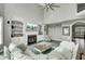 Comfortable living room featuring a fireplace, built-in shelving, and neutral color palette at 2745 Oak Manor Dr, Mount Pleasant, SC 29466