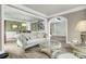 Comfortable living room featuring hardwood floors, neutral paint, and an archway to the foyer at 2745 Oak Manor Dr, Mount Pleasant, SC 29466