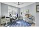 Well-lit home office with a large window, desk, and comfortable seating at 2745 Oak Manor Dr, Mount Pleasant, SC 29466