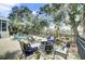 Outdoor patio area with a fire pit, lounge chairs, and lush landscaping at 2745 Oak Manor Dr, Mount Pleasant, SC 29466