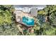 Aerial view of a private backyard pool and patio area, surrounded by lush landscaping for ultimate relaxation and privacy at 2745 Oak Manor Dr, Mount Pleasant, SC 29466