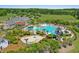 Resort-style community pool featuring a large swimming area, water slide, and lounge chairs, surrounded by beautiful landscaping at 2745 Oak Manor Dr, Mount Pleasant, SC 29466
