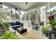 Inviting screened porch featuring comfortable seating and a ceiling fan at 2745 Oak Manor Dr, Mount Pleasant, SC 29466