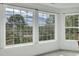 Bright room featuring large windows with scenic views of the surrounding trees and landscape at 2745 Oak Manor Dr, Mount Pleasant, SC 29466