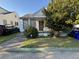 Charming single-story home with a small front porch and tidy landscaping at 28 Gordon St, Charleston, SC 29403