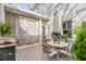 Inviting back patio featuring outdoor dining set, overhead string lights, and a grill at 3019 Viscount St, Charleston, SC 29424