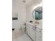 Well-lit bathroom featuring a round mirror, vanity, and white and gold finishes at 3019 Viscount St, Charleston, SC 29424