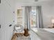 Cozy bedroom featuring neutral walls, gray curtains and a comfortable chair at 3019 Viscount St, Charleston, SC 29424