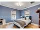Bedroom with blue walls, hardwood floors, and a modern bed at 3019 Viscount St, Charleston, SC 29424