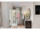 Foyer with dark wood dresser, mirror and an open door at 3019 Viscount St, Charleston, SC 29424