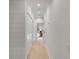 Bright hallway with hardwood floors and shiplap accent wall, leading to a bedroom at 3019 Viscount St, Charleston, SC 29424