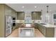 Bright kitchen with ample cabinetry, stainless steel appliances, and a center island with seating at 3019 Viscount St, Charleston, SC 29424