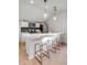 Modern kitchen with stainless steel appliances, a central island with seating, and stylish pendant lighting at 3019 Viscount St, Charleston, SC 29424