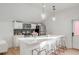 Modern kitchen with stainless steel appliances, a central island with seating, and stylish pendant lighting at 3019 Viscount St, Charleston, SC 29424