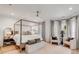 Spacious main bedroom with a four-poster bed, sitting area, and neutral tones at 3019 Viscount St, Charleston, SC 29424