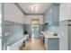 Well-organized mudroom with custom blue cabinetry, bench seating, and natural light at 3019 Viscount St, Charleston, SC 29424