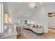 Bright sitting room featuring a curved sofa, chic lighting, and wood floors at 3019 Viscount St, Charleston, SC 29424