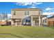 Large backyard with a well-maintained lawn, screened porch, and pergola, offering ample space for recreation at 302 Willow Pointe Cir, Summerville, SC 29486