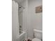 Clean bathroom featuring a shower/tub combo with white tile surround, toilet, and wood-look flooring at 302 Willow Pointe Cir, Summerville, SC 29486