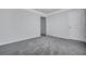 Neutral bedroom featuring gray carpet, crown molding, and standard doors leading to other rooms at 302 Willow Pointe Cir, Summerville, SC 29486