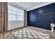 Well-lit room featuring a decorative rug, wood floors, and a stylish accent wall at 302 Willow Pointe Cir, Summerville, SC 29486