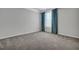 Neutral bedroom featuring gray carpet, crown molding, large windows and blue curtains at 302 Willow Pointe Cir, Summerville, SC 29486