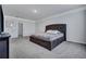 Bright bedroom features neutral walls, plush carpeting, and an adjacent bathroom at 302 Willow Pointe Cir, Summerville, SC 29486