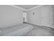 A simple bedroom with a gray carpet and minimalist decor at 302 Willow Pointe Cir, Summerville, SC 29486