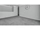 Empty neutral bedroom features gray carpet and a large clock decoration on the wall at 302 Willow Pointe Cir, Summerville, SC 29486