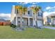 Attractive two-story home with gray siding, palm trees, and a well-manicured lawn at 302 Willow Pointe Cir, Summerville, SC 29486