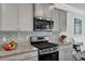 Modern kitchen features granite counters, tiled backsplash, and stainless steel appliances at 302 Willow Pointe Cir, Summerville, SC 29486